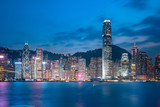 Fototapeta Londyn - Cityscape and skyline at Victoria Harbour in Hong Kong city at Night