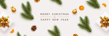 Merry Christmas And Happy New Year Banner. Xmas Background With Realistic Festive Decorative Design Elements. Pine And Spruce Branches, Gift Box, Pine Cone, Orange, Ball Bauble. Flat Lay, Top View.