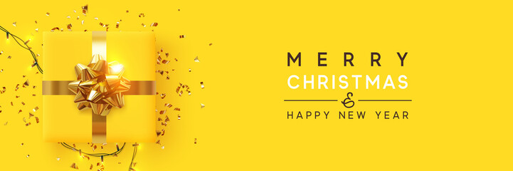 Wall Mural - merry christmas and happy new year. yellow background with realistic festive gifts box. xmas present