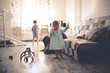 © natalialeb - happy mom with two children on the floor in room