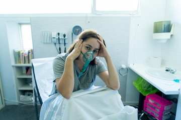 Wall Mural - Sick woman with oxygen mask in emergency room at hospital