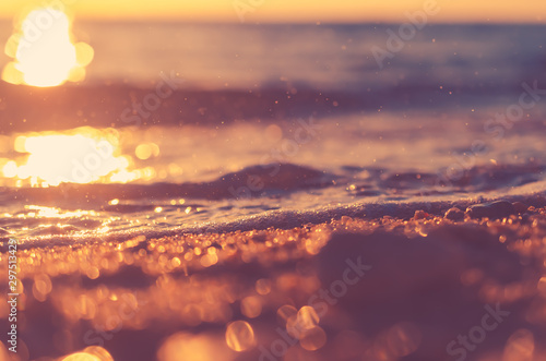 Copy space of soft sand sea and blur tropical beach with sunset sky and cloud...