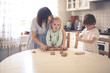 © natalialeb - funny kids siblings with mom cook in the kitchen