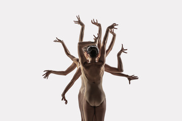 The group of modern ballet dancers. Contemporary art ballet. Young flexible athletic men and women in ballet tights. Studio shot isolated on white background. Negative space.