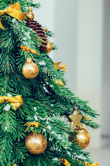 Wall Mural - Green fir tree with golden balls. Christmas wallpaper.