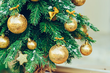 Wall Mural - Green fir tree with golden balls. Christmas wallpaper.