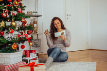Cute Smiling Woman Reading Christmas Postcard.