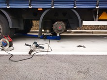 Replacement Of A Flat Tire On A Highway Truck Semitrailer.Removed Tire From Wheel Disc On Truck. Tire Puncture On Highway.