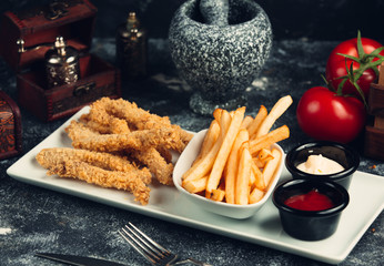 Poster - chicken nuggets, served with fried potato, mayonnaise and tomato