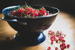 Red currants in a colander bowl