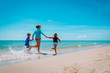 © nadezhda1906 - mother with kids play with water run on beach