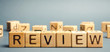 Wooden blocks with the word Review. Customer review concept. Reviewing, auditing, reviewer. Service rating. Feedback.