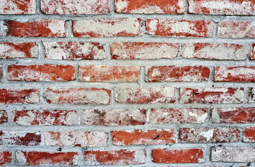 Old red white brick wall as a background.