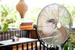 Electric fan cooling air during a hot day.