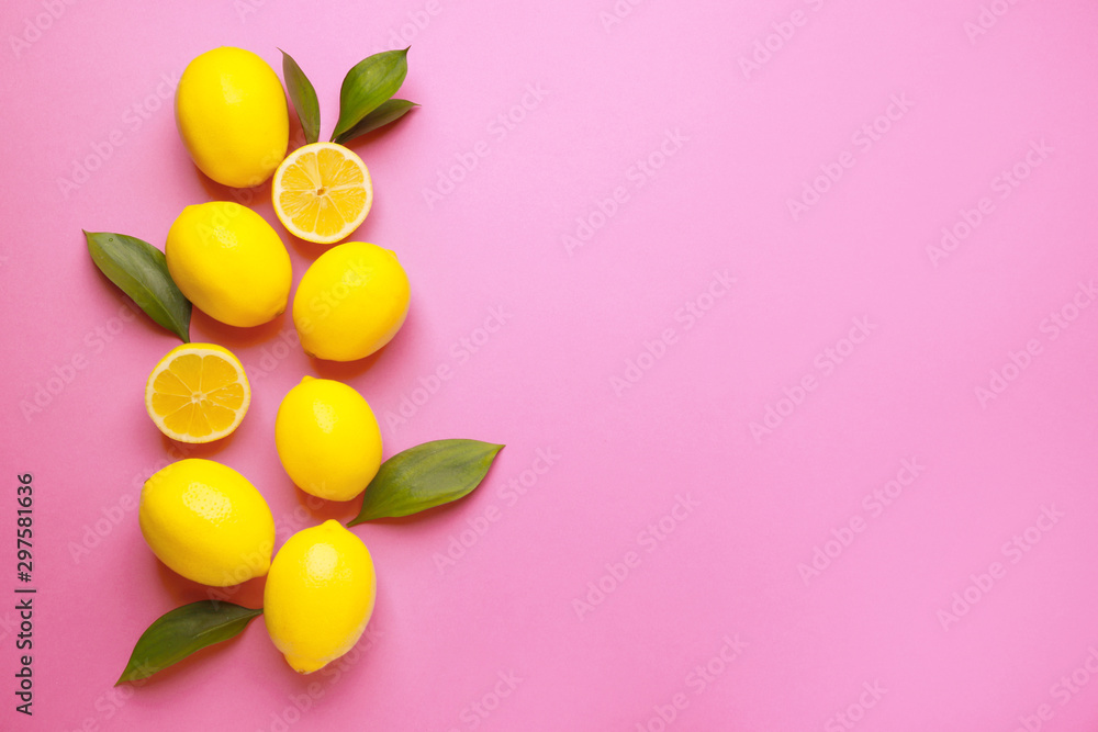 Ripe lemons on color background