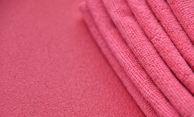 Poster - pink towels in a fold on a pink background