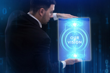 The concept of business, technology, the Internet and the network. A young entrepreneur working on a virtual screen of the future and sees the inscription: Our vision