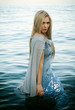 © Volodymyr - beautiful girl stands in the water on the seashore