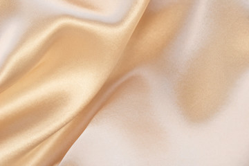 Shiny beige luxury silk background 