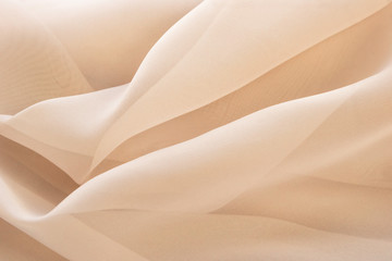 Light abstract beige textile background
