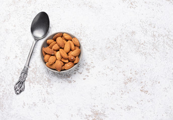 Wall Mural - spoon almond in bowl food background