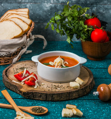 Wall Mural - tomato soup garnished with grated cheese and bread stuffing