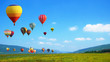 Hot Air balloons flying over mountain landscape background.