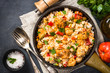 © nadianb - Rice with chicken and vegetables top view.