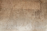 Fototapeta  - Scene of the Churning of the Milk Ocean carvings status on the wall of Angkor wat temple, world heritage, Siemreap, Cambodia