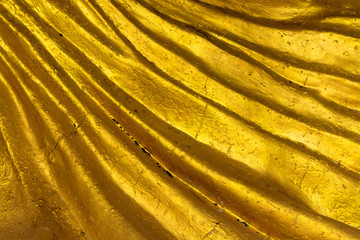 Wall Mural - abstract pattern of gold background,wave surface of golden stone.