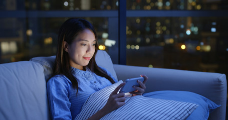 Poster - Woman watch video on cellphone at night