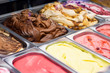 containers with various types of ice cream