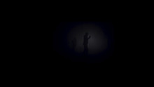 A Lonely Man Exploring Deep Dark Cave. Stock Footage. Silhouette Of A Person Standing Inside Of The Cave On The Background Of The Mystical Moonlit.
