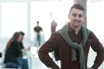 Canvas Print - confident young man in the background of the office.