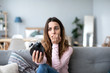 © BestForYou - Shocked oversleep woman looking at the alarm clock.