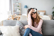 © BestForYou - Depressed young girl in casual wear sit on bed.