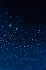 Wall Mural - Abstract glitter shining lights background. De-focused lights