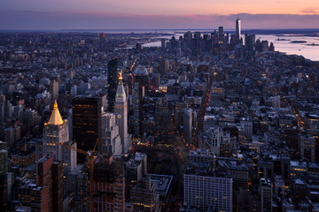 Wall Mural - New York City aerial view of the skyscrapers of Manhattan at twilight. The view includes Lower Manhattan, Union Square, Midtown, New York Harbor, and Brooklyn. NY, USA