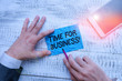© A - Text sign showing Time For Business. Business photo text fulfil transactions within period promised to client Hand hold note paper near writing equipment and modern smartphone device