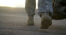 Slow Motion Military Army Boots Walking At Sunrise