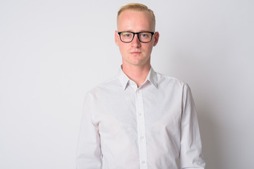 Face of young blonde businessman with eyeglasses