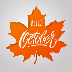 Wall Mural - Hello October lettering with maple leaf on light background. Paper cut style. Modern brush calligraphy. Autumn banner. typography for social media banner, greeting card, poster, flyer.