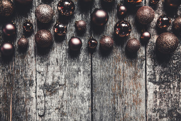 Christmas or New Year background. Vintage tree toy decoration balls over rustic wooden background