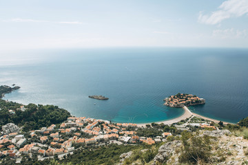 Wall Mural - Beautiful view of the sea, the coastal city and the island of Sveti Stefan in Montenegro.