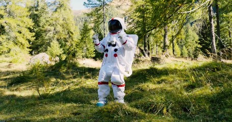 Wall Mural - astronaut has find a new planet similar to earth with nature and forests