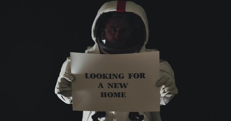 Wall Mural - astronaut lost in space with a message for humanity