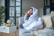 © zinkevych - Sick man spending day in living room while drinking tea