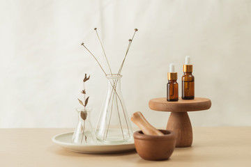 Wall Mural - glass flask and test tubes with flowers for medical health or cosmetic science research laboratory