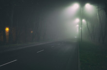 The Thick Fog Above The Asphalt Road In The Night In The City