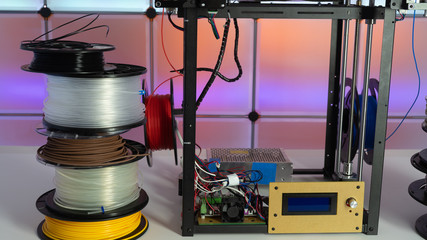 Poster - 3d printer and plastic filament on color background